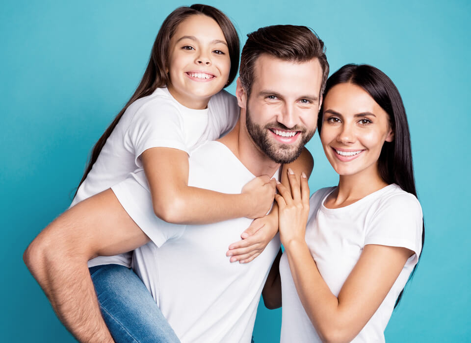 Image showing a smiling family a man , woman and a girl